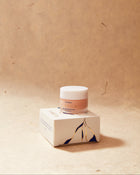Eleusia Skincare product with packaging on a beige background